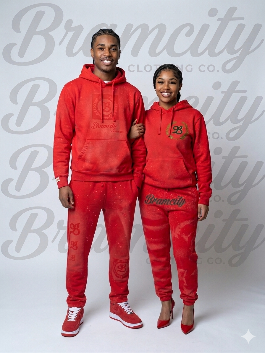 Two people wearing matching red outfits with 'Bramcity' branding on a light gray background.